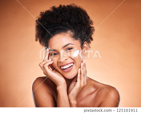 Skincare, face and cream of black woman in studio for cosmetics, beauty and healthy glow with mockup for promotion, advertising or marketing. Young model portrait with sunscreen for dermatology care Skincare, face and cream of black woman in studio for cosmetics, beauty and healthy glow with mockup for promotion, advertising or marketing. Young model portrait with sunscreen for dermatology care 125101911