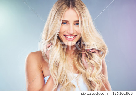 Luxury, hair and portrait with beauty woman and wavy hairstyle volume for cosmetic advertising. Hair care, wellness and happy model smile holding curls on colorful studio gradient with mockup. Luxury, hair and portrait with beauty woman and wavy hairstyle volume for cosmetic advertising. Hair care, wellness and happy model smile holding curls on colorful studio gradient with mockup. 125101966