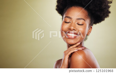 Beauty, skincare and black woman in a studio for a natural face routine with mockup space. Happy, smile and African model with a smile doing a facial treatment by a green background with copy space. 125101968