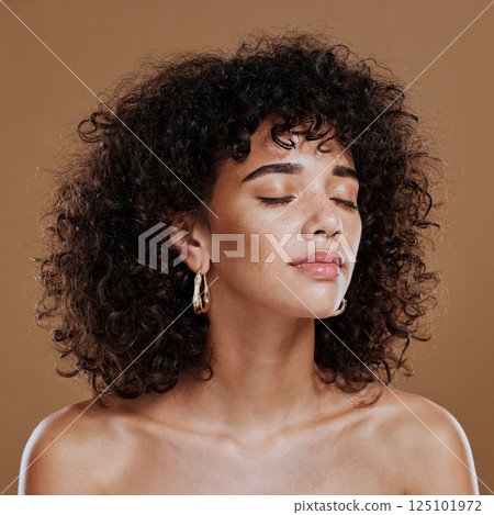 Woman, beauty and freckles, curly hair and facial treatment, makeup and body care aesthetics, shine or glow on studio background. Young model, melasma face and natural cosmetics, skincare or wellness Woman, beauty and freckles, curly hair and facial treatment, makeup and body care aesthetics, shine or glow on studio background. Young model, melasma face and natural cosmetics, skincare or wellness 125101972