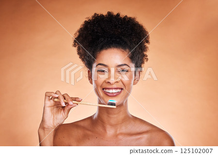 Black woman, portrait and toothbrush for cleaning, teeth and dental health or wellness on a brown studio background. Oral, health and brushing teeth with african american woman with oral hygiene Black woman, portrait and toothbrush for cleaning, teeth and dental health or wellness on a brown studio background. Oral, health and brushing teeth with african american woman with oral hygiene 125102007
