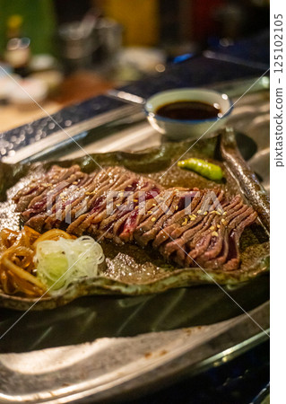 a Japanese grill with beef cutlets 125102105