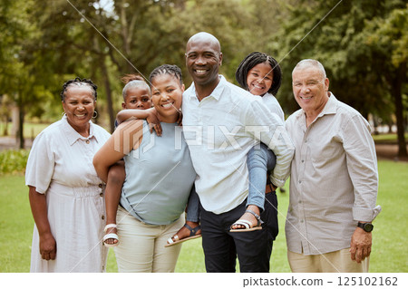 Big family, happiness and love while outdoor at a park for bonding, support and quality time on vacation with children, parents and grandparents. Portrait of men, women and kids in nature for fun 125102162