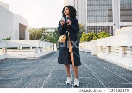 Phone, thinking and coffee with a young woman, travel or social media while standing outdoor in the city. Idea, mobile smartphone or female looking away, think about the future or drink in urban town 125102179