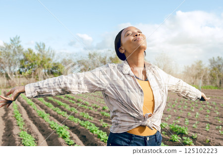 Farmer, freedom and woman feeling carefree and joy on agriculture field or plantation before harvest. Free, african american female and eco friendly field for ecology, eco and earth for farming 125102223