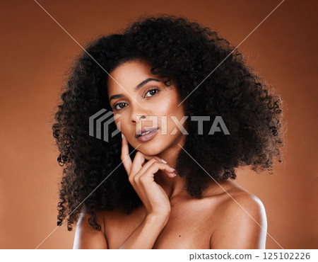 Skincare, beauty and portrait of a black woman in a studio with healthy, natural and face routine. Wellness, face and African model with health, facial and cosmetic skin treatment by brown background Skincare, beauty and portrait of a black woman in a studio with healthy, natural and face routine. Wellness, face and African model with health, facial and cosmetic skin treatment by brown background 125102226