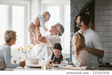 Family, kitchen and grandpa playing with baby having fun, bonding and relax together. Big family, support or care of grandfather carrying newborn with mother, father and girl child cooking in house Family, kitchen and grandpa playing with baby having fun, bonding and relax together. Big family, support or care of grandfather carrying newborn with mother, father and girl child cooking in house 125102416