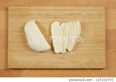 Sliced mozzarella cheese 125102745