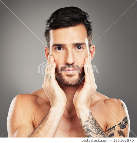 Skincare, beauty and portrait of a man with face for cosmetics against a grey studio background. Wellness, body and a young cosmetic model with care and health of skin and beard with dermatology Skincare, beauty and portrait of a man with face for cosmetics against a grey studio background. Wellness, body and a young cosmetic model with care and health of skin and beard with dermatology 125102870