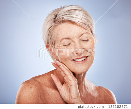 Beauty, skincare and mature woman for happy, health and wellness with smile on a grey studio background. Anti aging, senior female and fresh, glowing and healthy skin care and body care 125102871