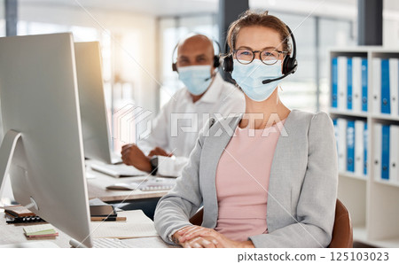 Covid, call center and portrait in office with medical mask for safety, health and protection from virus at pc. Consultant, telemarketing and workplace people with corona face mask at computer. Covid, call center and portrait in office with medical mask for safety, health and protection from virus at pc. Consultant, telemarketing and workplace people with corona face mask at computer. 125103023
