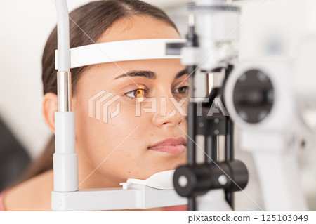Healthcare, eyes and woman eye test at a clinic for vision, health and eyesight on a slit lamp examination. Face, eye care and girl consulting optometrist for sight, wellness and glaucoma testing Healthcare, eyes and woman eye test at a clinic for vision, health and eyesight on a slit lamp examination. Face, eye care and girl consulting optometrist for sight, wellness and glaucoma testing 125103049