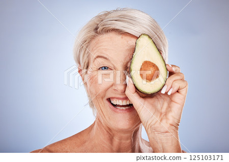 Skincare, avocado and senior woman with smile, natural beauty and confident against grey studio background. Cosmetics, mature female and elderly lady with avo for facial oils for wellness and health Skincare, avocado and senior woman with smile, natural beauty and confident against grey studio background. Cosmetics, mature female and elderly lady with avo for facial oils for wellness and health 125103171