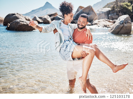 Couple, beach and man carrying woman for love, marriage support and funny holiday vacation. Travel, quality time together and summer freedom in Hawaii, sunshine and relax on ocean sand for happiness 125103178