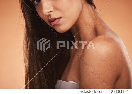 Woman, skincare and beauty with healthy hair, skin glow and cosmetics for makeup, wellness and health. Young cosmetic model, natural aesthetic and facial portrait with self care by studio background 125103195