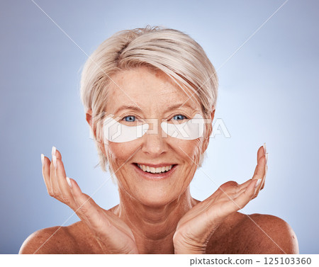 Skincare, senior woman and eye patches for cosmetic, wellness and natural face routine in studio. Cosmetics, beauty and portrait of elderly lady with anti aging treatment isolated by gray background. Skincare, senior woman and eye patches for cosmetic, wellness and natural face routine in studio. Cosmetics, beauty and portrait of elderly lady with anti aging treatment isolated by gray background. 125103360