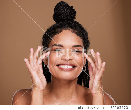 Black woman, face and smile for skincare, makeup or cosmetics against a brown studio background. Portrait of African American female smiling with teeth in satisfaction for cosmetic facial treatment 125103370