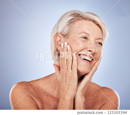 Cosmetics, senior woman and with skincare, smile and wellness with natural beauty against blue studio background. Makeup, mature lady and elderly female with health, confident or smooth skin for glow Cosmetics, senior woman and with skincare, smile and wellness with natural beauty against blue studio background. Makeup, mature lady and elderly female with health, confident or smooth skin for glow 125103394