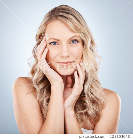 Hair, makeup and beauty woman in studio for skincare, cosmetics and spa wellness promotion, marketing or advertising. Blonde model face or headshot of hair care, dermatology and skin care in portrait 125103648