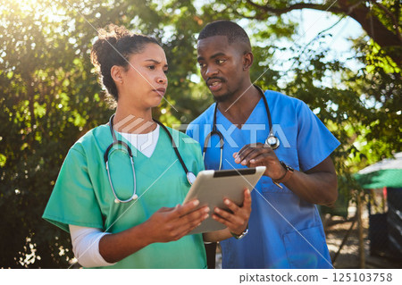 Doctor, team and tablet in healthcare discussion for medical prescription, consultation or procedure at a park. Doctors or veterinarian workers in conversation with touchscreen for research outdoors 125103758