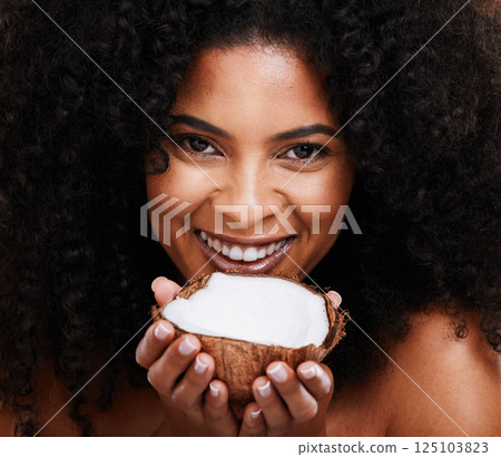Beauty, portrait and woman holding coconut for organic skincare, bodycare and glowing skin. African american female, body care and skin care with fruit for natural cosmetology product Beauty, portrait and woman holding coconut for organic skincare, bodycare and glowing skin. African american female, body care and skin care with fruit for natural cosmetology product 125103823