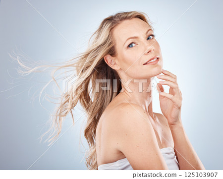 Beauty, skincare and hair care wind of a woman model with skincare and cosmetic skin health. Portrait of a young female with body glow and healthy hair shine from salon or cosmetics treatment Beauty, skincare and hair care wind of a woman model with skincare and cosmetic skin health. Portrait of a young female with body glow and healthy hair shine from salon or cosmetics treatment 125103907