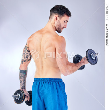 Bodybuilder back, dumbbells and background in studio for fitness, health or training with focus. Man, weightlifting exercise and sport workout for body, power and muscle with iron for bodybuilding Bodybuilder back, dumbbells and background in studio for fitness, health or training with focus. Man, weightlifting exercise and sport workout for body, power and muscle with iron for bodybuilding 125103928