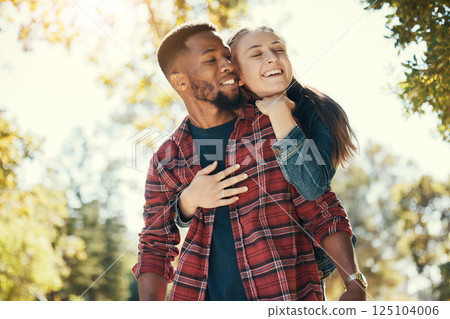 Love, woman and hug man from behind, happy and loving together in nature, quality time and romance. Romantic, couple and embrace for relationship, interracial and happiness outdoor, dating and smile. Love, woman and hug man from behind, happy and loving together in nature, quality time and romance. Romantic, couple and embrace for relationship, interracial and happiness outdoor, dating and smile. 125104006