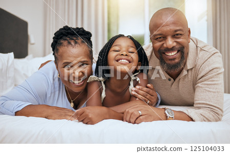 Black family, bed and relax together in bedroom at home for relationship bonding. Happy family, parents smile and excited child portrait, smiling or lay in morning for happiness in family home Black family, bed and relax together in bedroom at home for relationship bonding. Happy family, parents smile and excited child portrait, smiling or lay in morning for happiness in family home 125104033