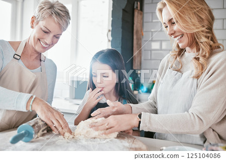 Family, children and baking with a mother, grandmother and girl in the kitchen learning about cooking. Kids, bake and food with a woman, daughter and granddaughter teaching a female child about flour Family, children and baking with a mother, grandmother and girl in the kitchen learning about cooking. Kids, bake and food with a woman, daughter and granddaughter teaching a female child about flour 125104086