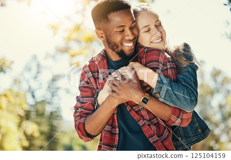 Love, nature and diversity couple hug on outdoor journey together, romantic park date and quality time fun. Sunshine flare, leaf and summer freedom peace for happy gen z woman and black man bonding Love, nature and diversity couple hug on outdoor journey together, romantic park date and quality time fun. Sunshine flare, leaf and summer freedom peace for happy gen z woman and black man bonding 125104159
