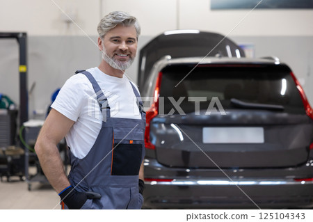 Automotive service expert performing inspection and fix vehicle 125104343