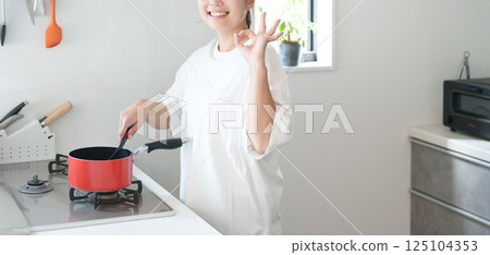 Woman cooking (OK, successful) Woman cooking (OK, successful) 125104353