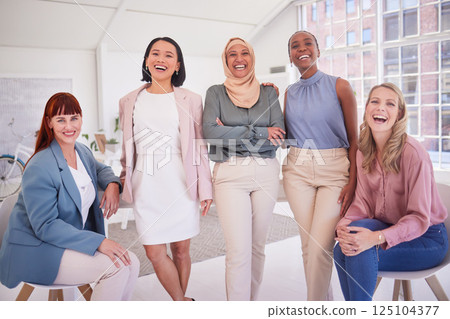 Diversity, women and portrait of a team in the office in meeting, team building or project planning. Happiness, collaboration and work friends standing together in their coworking space in workplace. Diversity, women and portrait of a team in the office in meeting, team building or project planning. Happiness, collaboration and work friends standing together in their coworking space in workplace. 125104377