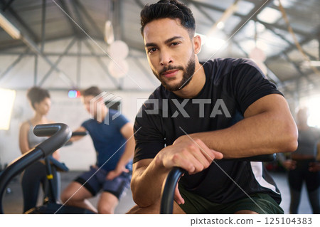 Gym, portrait and man exercise on spinning bike for health, training and fitness goal at a sports center. Personal trainer, coach and mexican man with a vision for wellness, heart health and workout Gym, portrait and man exercise on spinning bike for health, training and fitness goal at a sports center. Personal trainer, coach and mexican man with a vision for wellness, heart health and workout 125104383