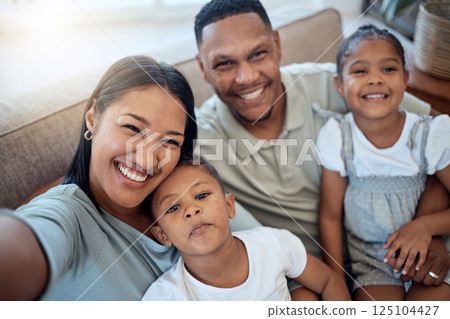 Happy family, selfie and home portrait of a mother, father and children with a smile. Black family, mom and man together with love, parent care and bonding on a sofa with morning happiness and hug 125104427
