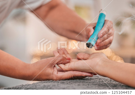 Spa, wellness and moxibustion treatment for hand in salon with alternative healing, natural medicine and therapy. Healthcare, luxury and massage therapist using smoke stick for stress relief in body 125104457