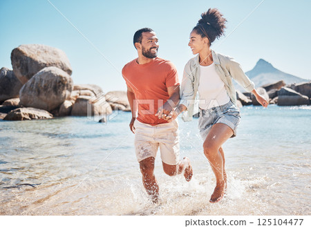 Black couple, beach and running while holding hands on vacation in summer by the sea for energy, love and care while bonding and spending quality time. Man and woman together on holiday in Bali 125104477