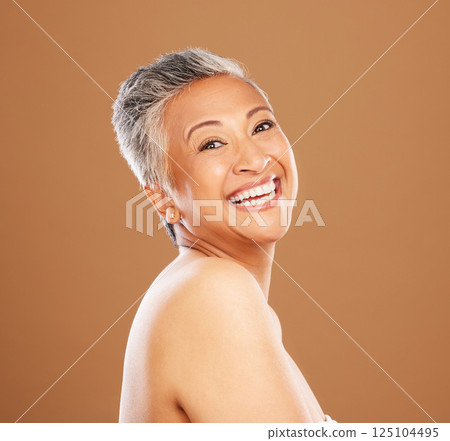 Happy senior woman, beauty and skincare on face model with healthy teeth giving a smile on studio background portrait. Dental, wellness and cosmetic makeup for elderly women, smile or skin wellness 125104495