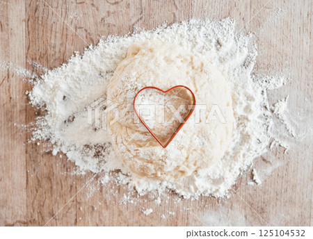 Bakery flour in kitchen, wood texture table and cooking dessert with heart cookie cutter. Love pastry in wheat cake dough, recipe for baking pizza bread and love language to bake food on weekend 125104532