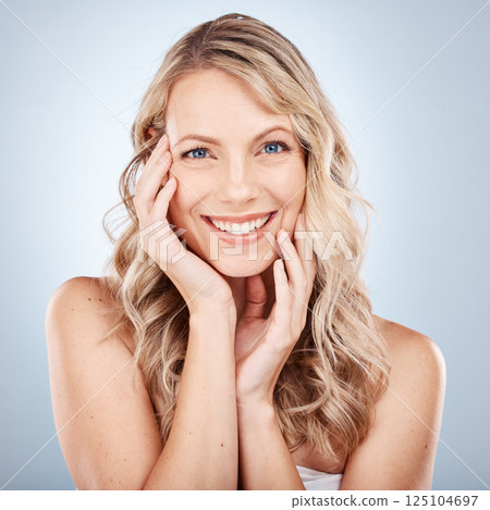Beauty portrait, face and skincare of woman in studio on gray background. Makeup, aesthetics or natural cosmetics of female model from Canada touching skin for facial wellness and skin health routine Beauty portrait, face and skincare of woman in studio on gray background. Makeup, aesthetics or natural cosmetics of female model from Canada touching skin for facial wellness and skin health routine 125104697