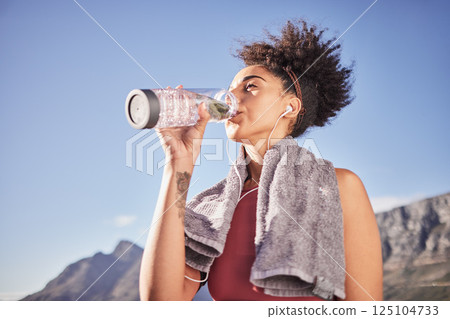 Music, drinking water and woman in nature for fitness, training and morning cardio run along mountain with mockup. Podcast, water and black woman relax after running with radio, wellness and track 125104733