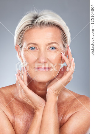 Woman, beauty and anti aging cosmetics skincare treatment for wrinkles with organic makeup cleanser, natural face and collagen product. Portrait of senior, facial treatment and gray studio background Woman, beauty and anti aging cosmetics skincare treatment for wrinkles with organic makeup cleanser, natural face and collagen product. Portrait of senior, facial treatment and gray studio background 125104804