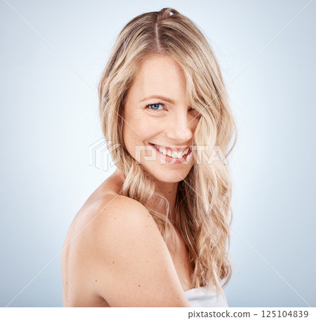 Face, beauty and hair with a model woman in studio on a gray background to promote natural keratin treatment. Portrait, cosmetics or haircare with an attractive young female proud of her strong locks Face, beauty and hair with a model woman in studio on a gray background to promote natural keratin treatment. Portrait, cosmetics or haircare with an attractive young female proud of her strong locks 125104839