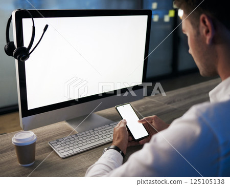 Cellphone, call center and customer service with a man consultant typing a text message in a sales office. Contact us, crm and ecommerce with an employee using a smartphone, working in telemarketing 125105138