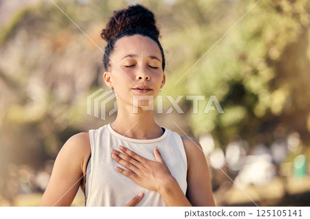 Yoga, meditation and fitness with a black woman breathing for calm exercise outdoor in a nature park. Wellness, health and meditate with a female yogi finding peace, balance or zen alone outside 125105141