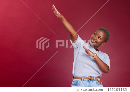 Dance, marketing and happy black woman in studio with a red background in celebration of a sale or discount. Success, winner and excited African girl dancing with pride with advertising mockup space 125105183