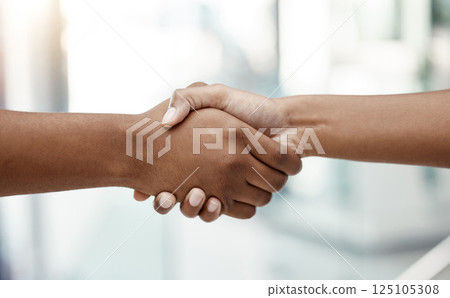 Handshake, interview and human resources manager networking with a businessman in an office building. We are hiring, diversity and business people shaking hands after a successful negotiation meeting 125105308