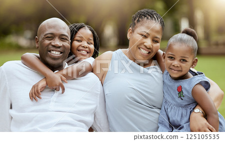 Happy black family, kids and portrait in park with love, pride or bonding together outdoor in summer. Happy family, black woman and man with children on grass for happiness, relax and vacation in sun 125105535