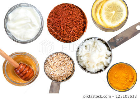 Ingredients honey, oatmeal, cocoa, yogurt, isolated objects on a white background Ingredients honey, oatmeal, cocoa, yogurt, isolated objects on a white background 125105638